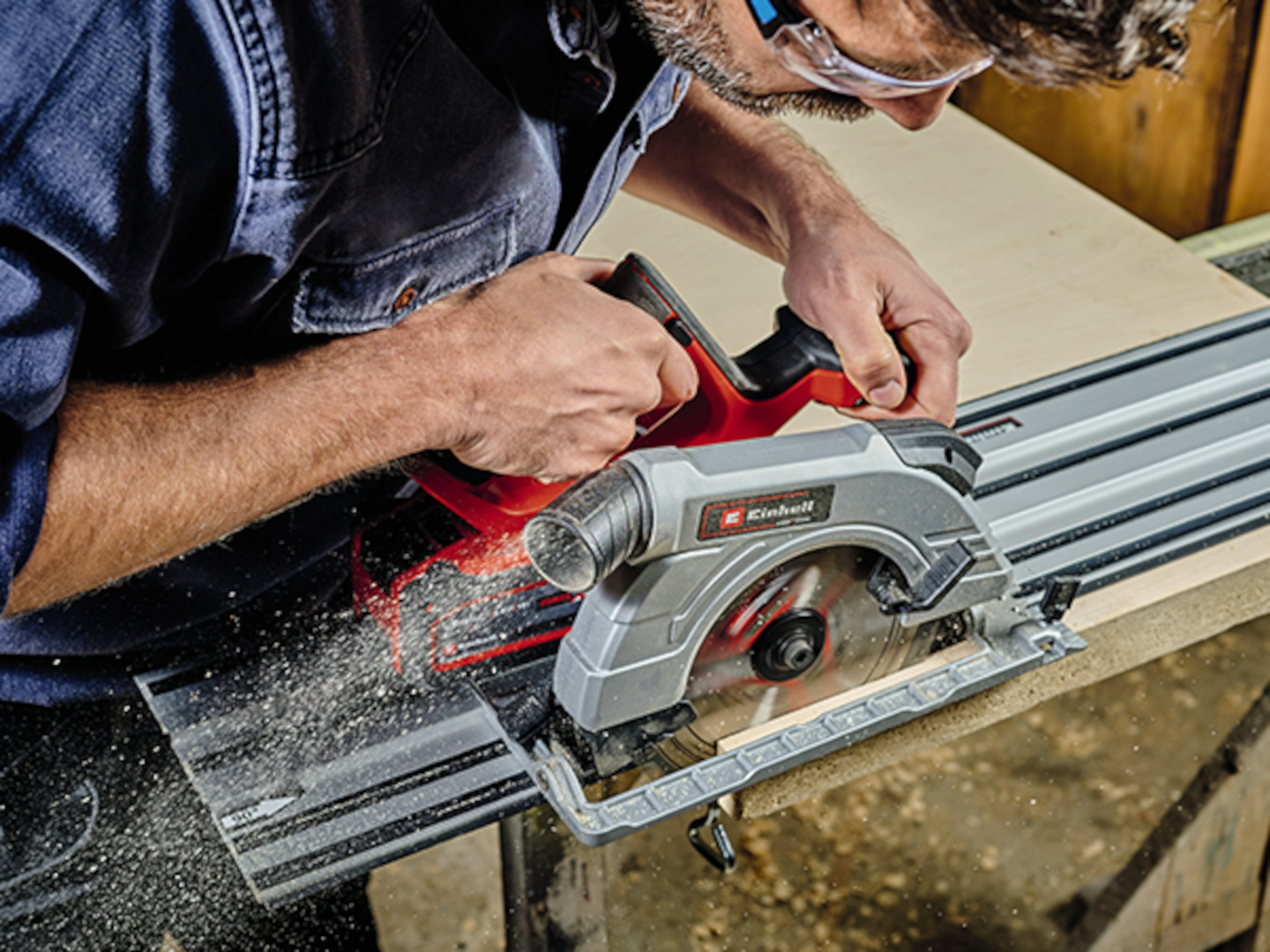 a man uses a cordless hand held circular saw