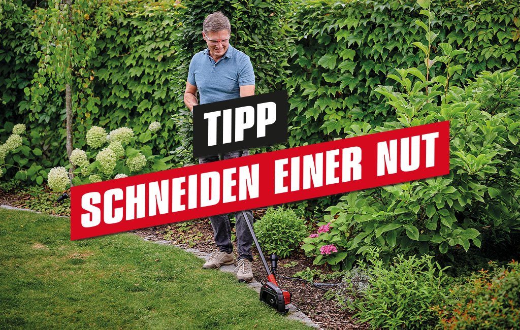 a man is trimming edges with the Einhell cordless lawn edge trimmer