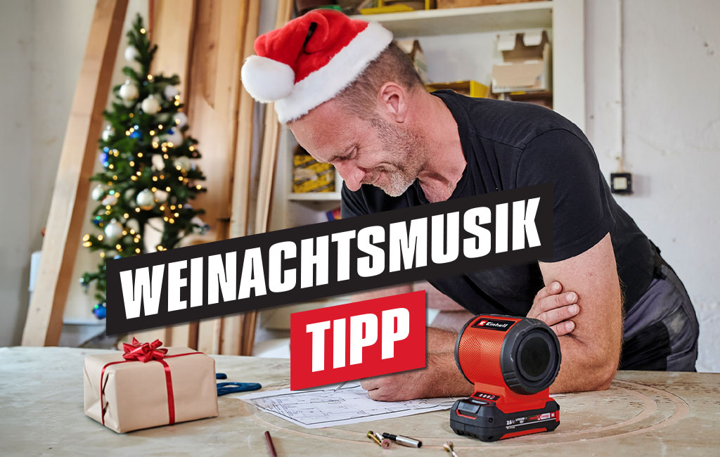 Man listens to music with the Einhell cordless loudspeaker