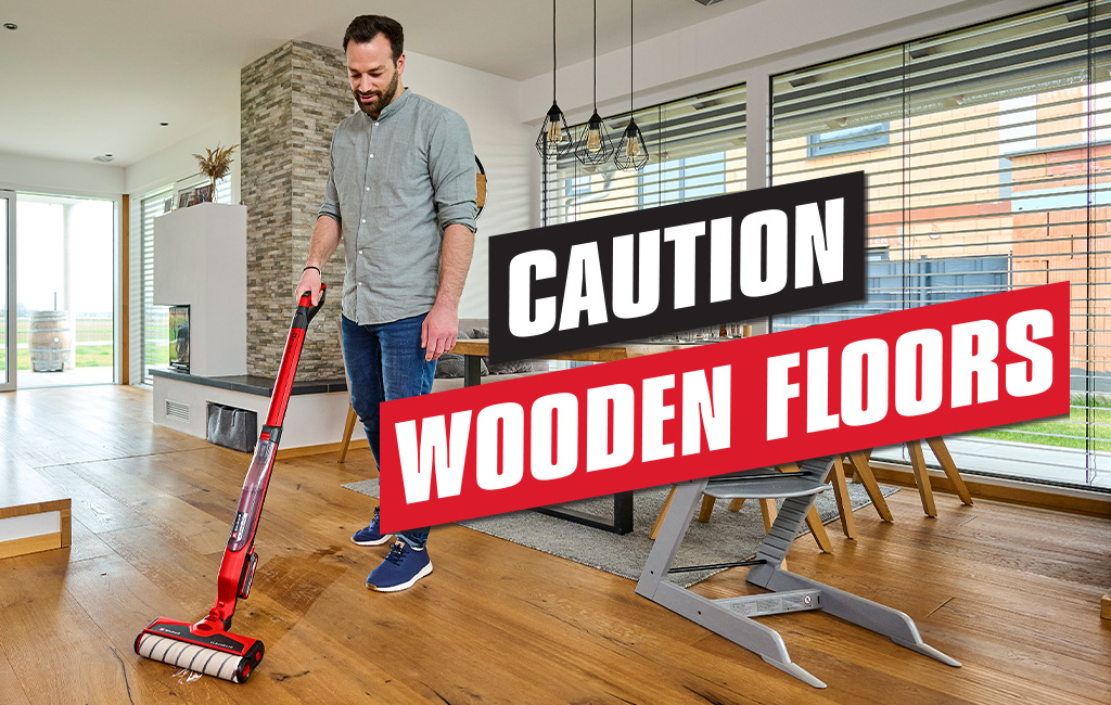 a man is cleaning the floor with the Einhell Cordless Hard Floor Cleaner CLEANEXXO