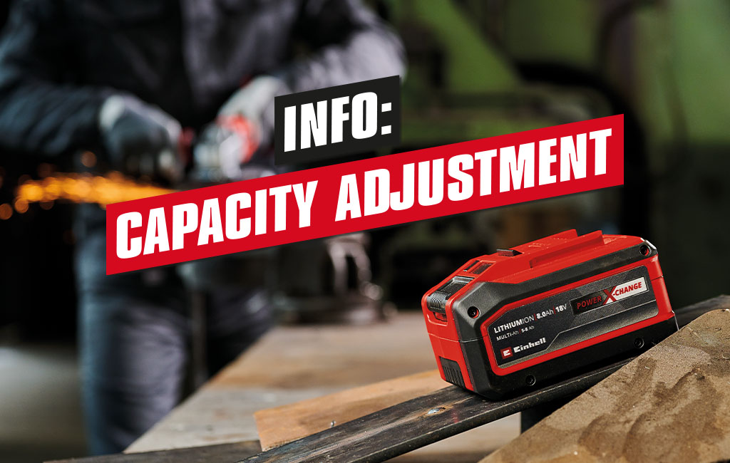 An Einhell Multi-Ah battery is placed on a workbench in a workshop | Text: Info - Capacity Adjustment