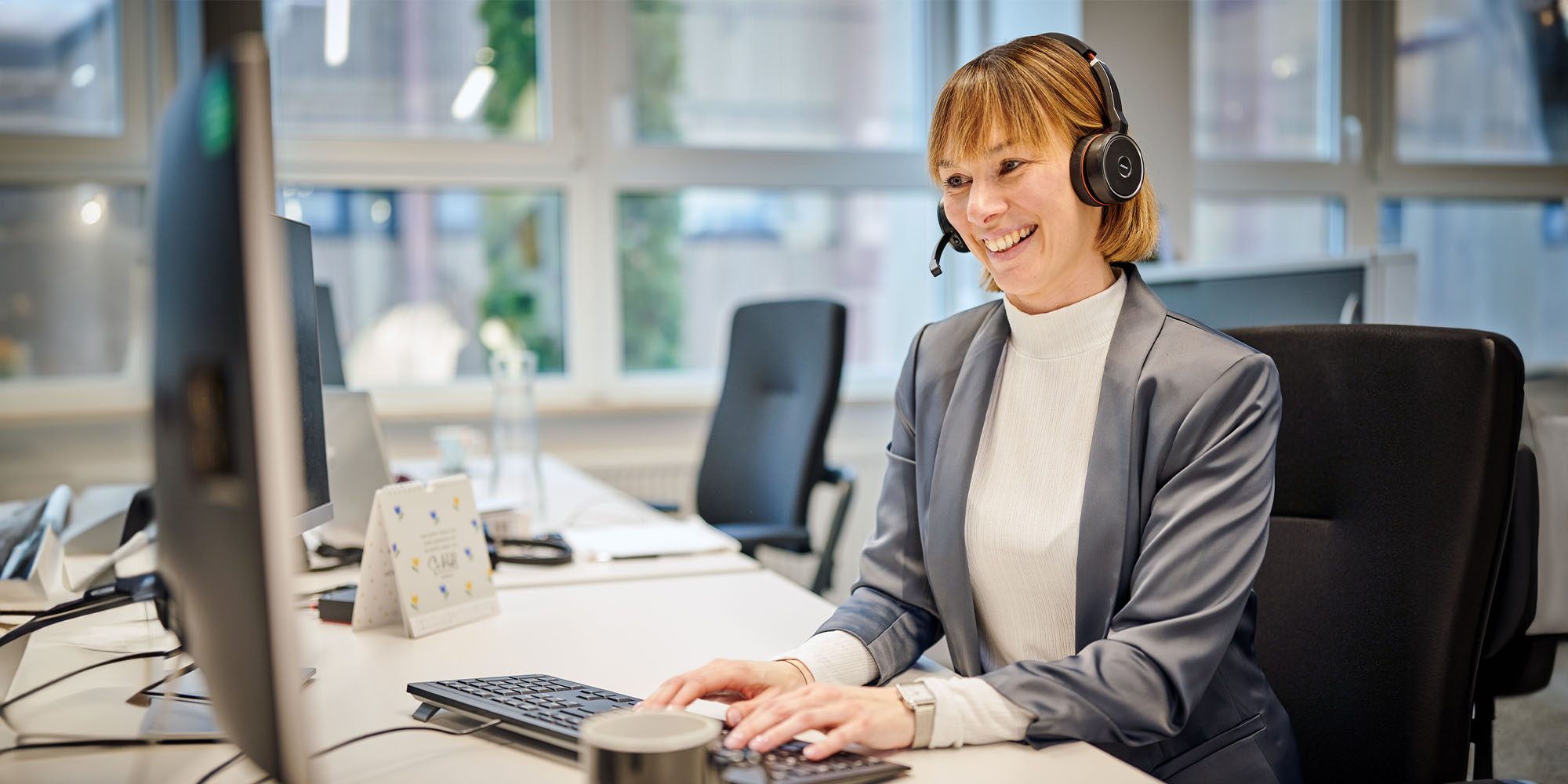 A woman working at the service desk.